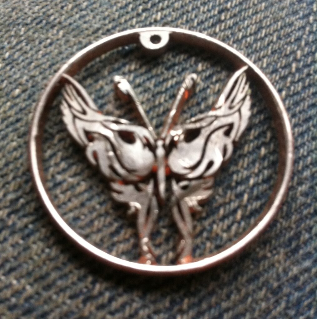 Hand-carved butterfly coin pendant by The Coin Slayer